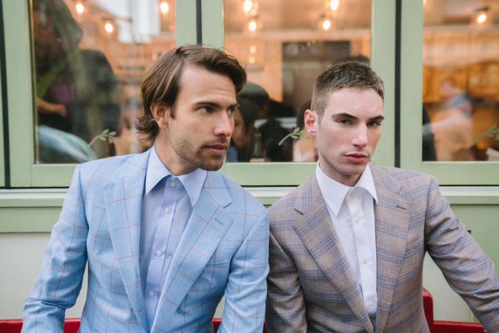 Lapel varieties example of notched lapels. Both men wear stunning custom suits with perfectly measured lapels.