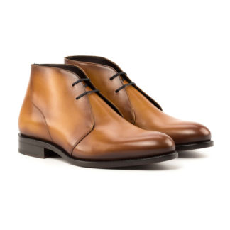 The Arborist: Cognac Box Calf. Front side view of cognac box calf leather ankle style boots with laces on a white background